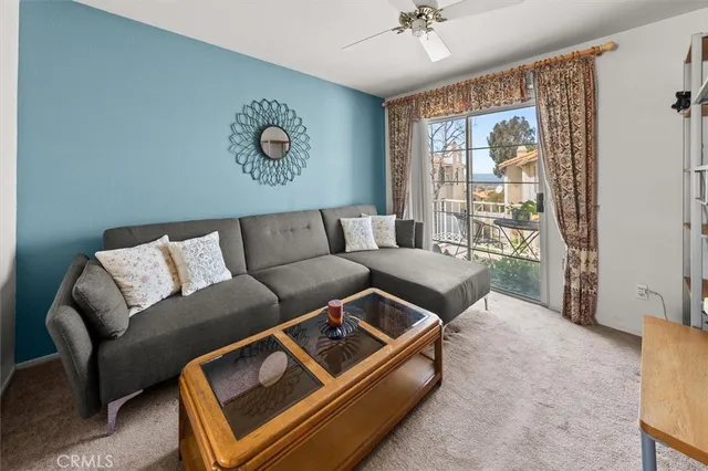 a view of a terrace with couches and wooden floor