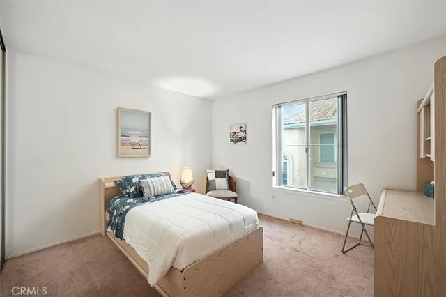 a view of a chair and table in the balcony