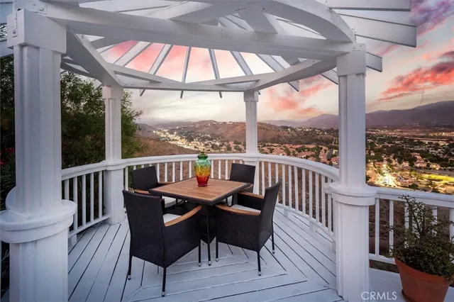 a aerial view of a house with swimming pool and furniture