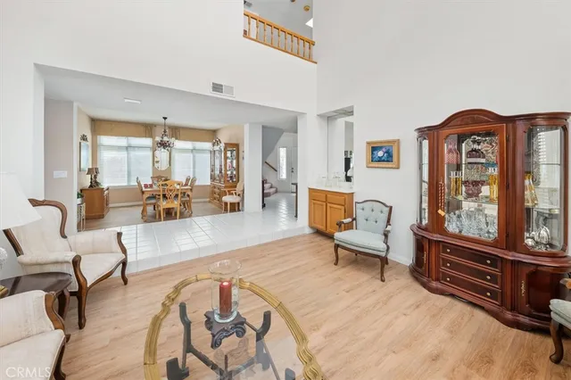 a kitchen with a sink window and cabinets