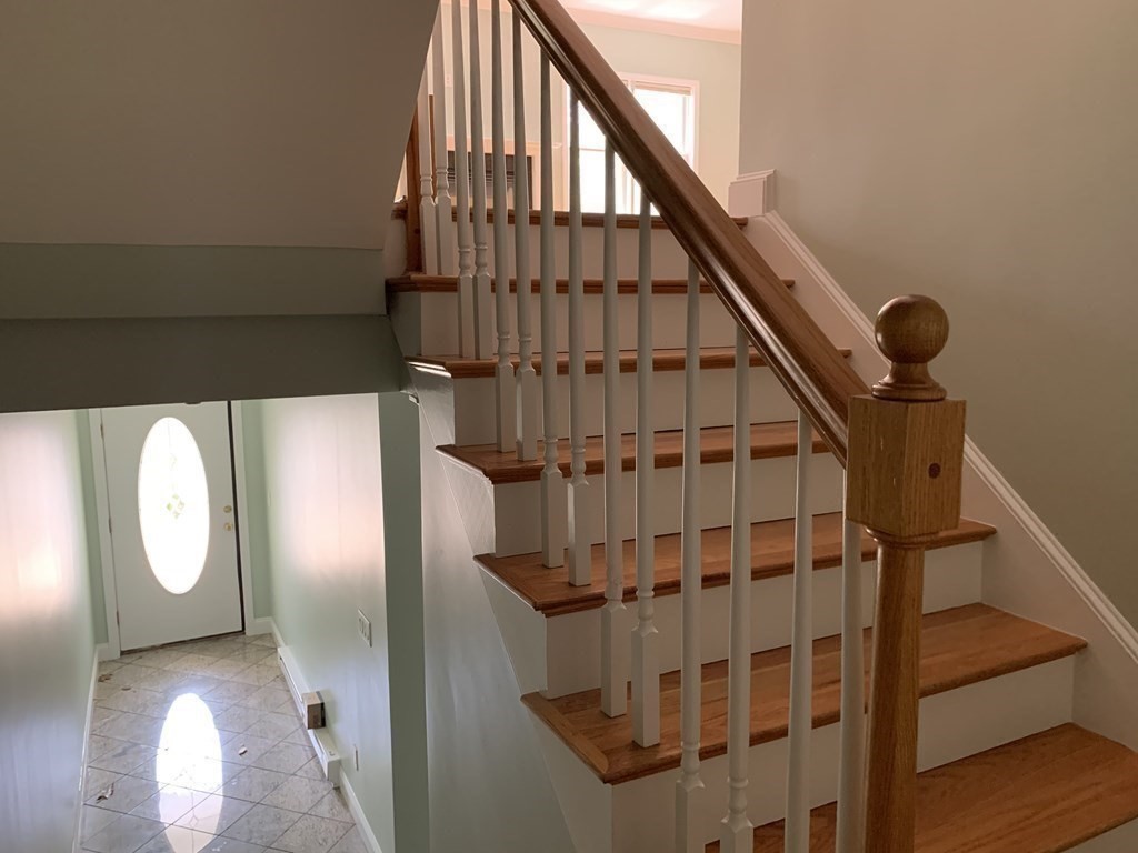 3 Dansereau Place, Unit 3 Middleton, MA 01949 - Photo 11 of 34 a view of staircase with wooden floor and white walls