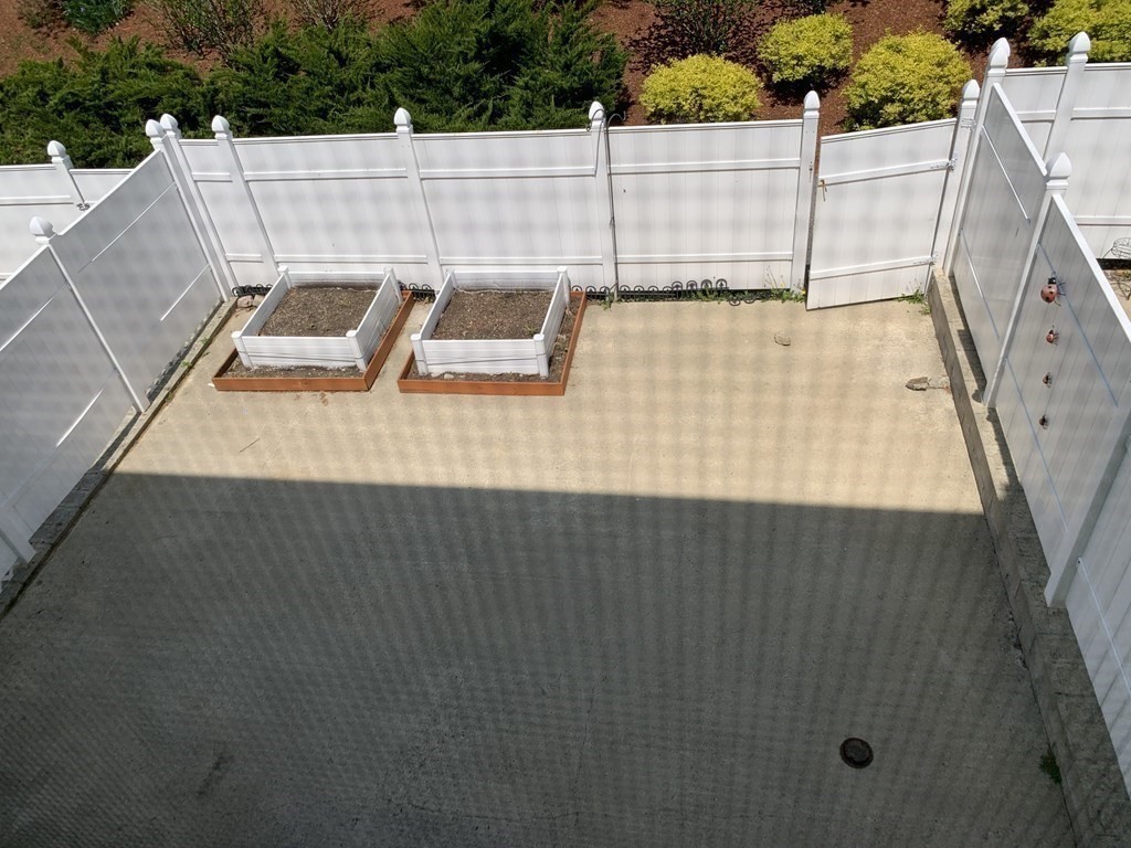 3 Dansereau Place, Unit 3 Middleton, MA 01949 - Photo 2 of 34 a view of deck and tennis court