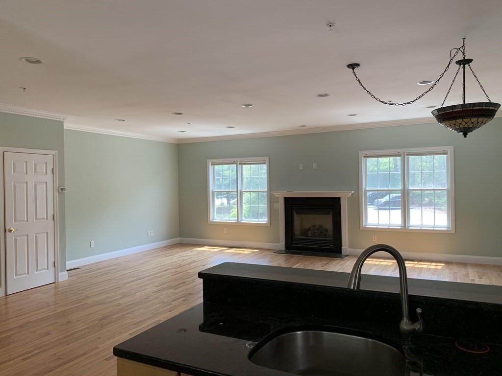 3 Dansereau Place, Unit 3 Middleton, MA 01949 - Photo 7 of 34 a living room with furniture pool table and a fireplace