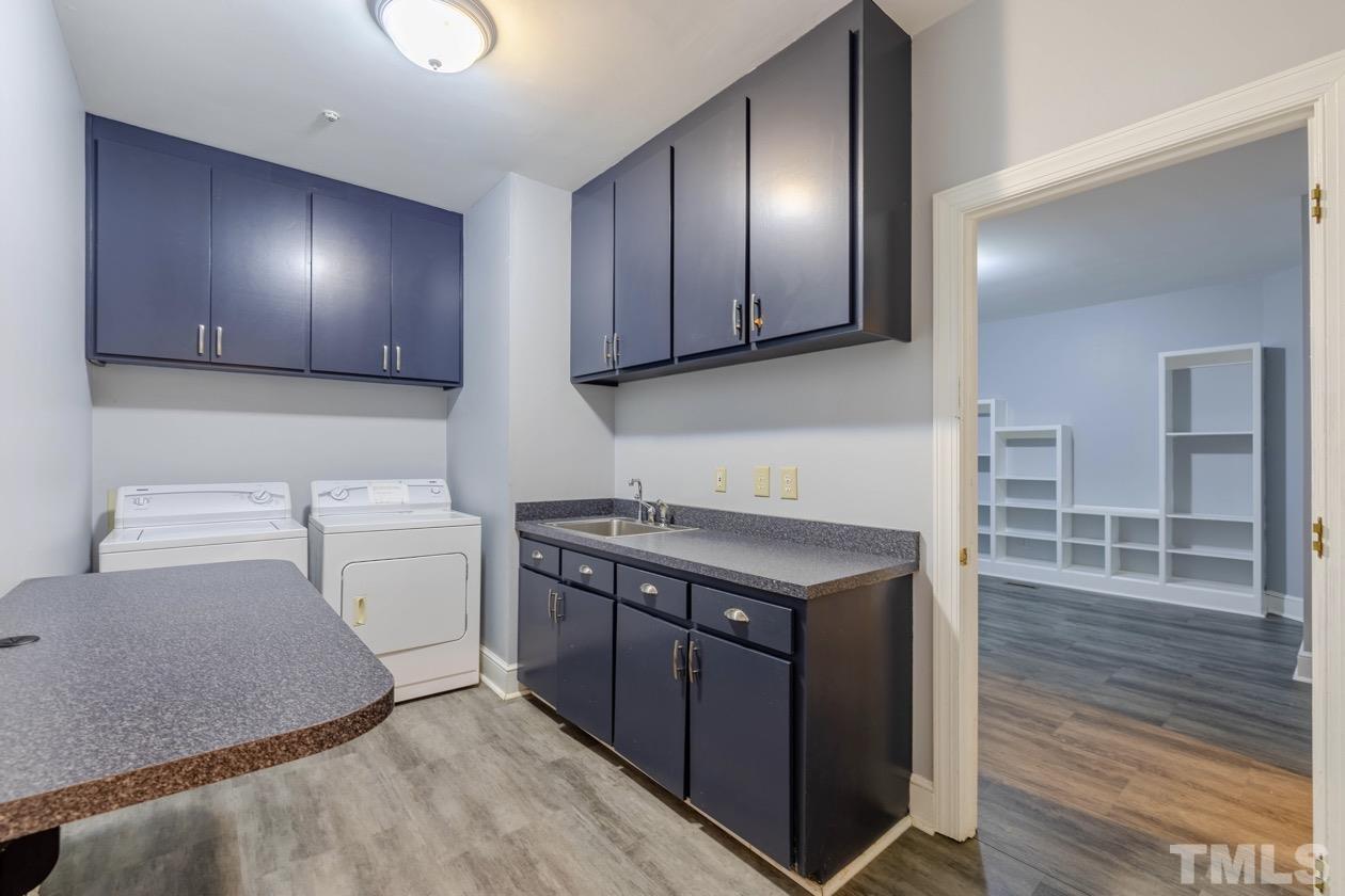 4205 Swarthmore Road Durham, NC 27707 - Photo 16 of 33 a kitchen with stainless steel appliances granite countertop a stove a sink and a microwave