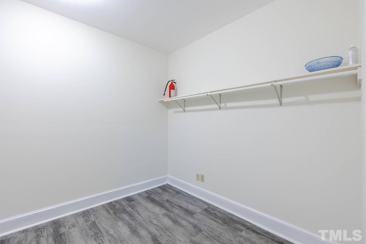 4205 Swarthmore Road Durham, NC 27707 - Photo 18 of 33 a view of a room with racks on the wall
