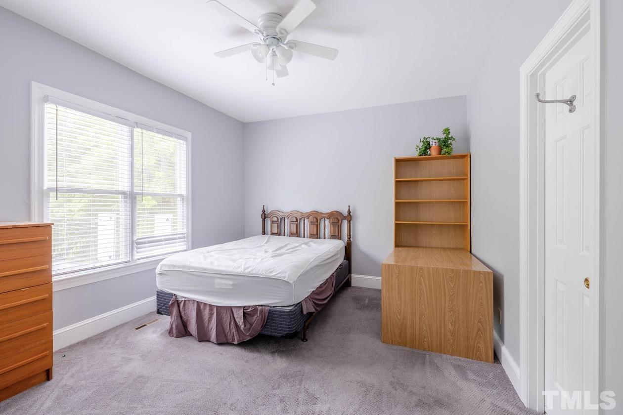 4205 Swarthmore Road Durham, NC 27707 - Photo 20 of 33 a bedroom with a bed and a window