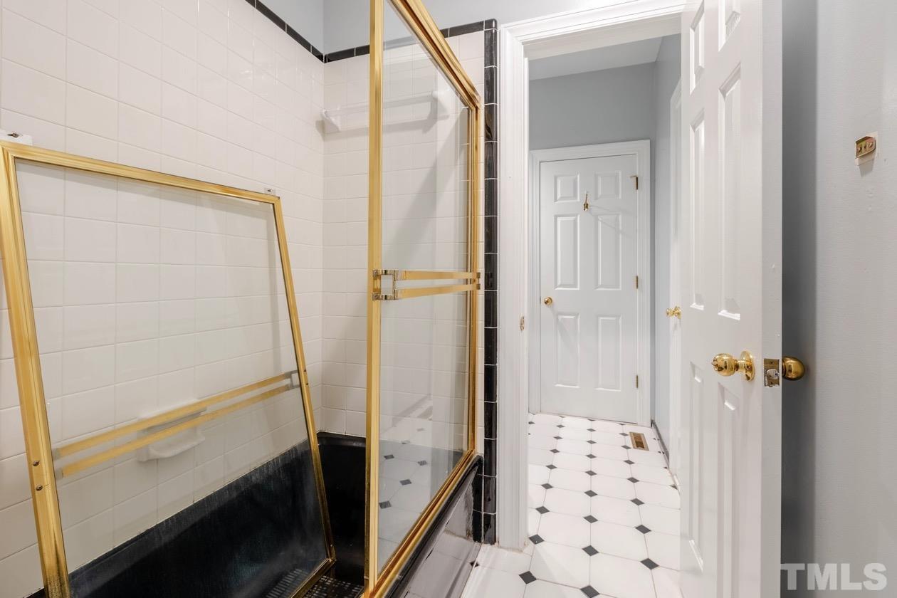 4205 Swarthmore Road Durham, NC 27707 - Photo 22 of 33 a bathroom with a bathtub and a shower