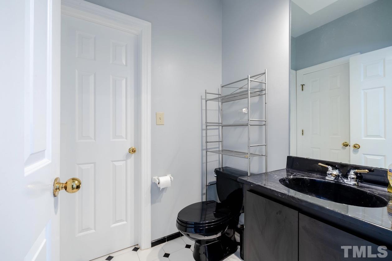 4205 Swarthmore Road Durham, NC 27707 - Photo 23 of 33 a bathroom with a sink and a toilet