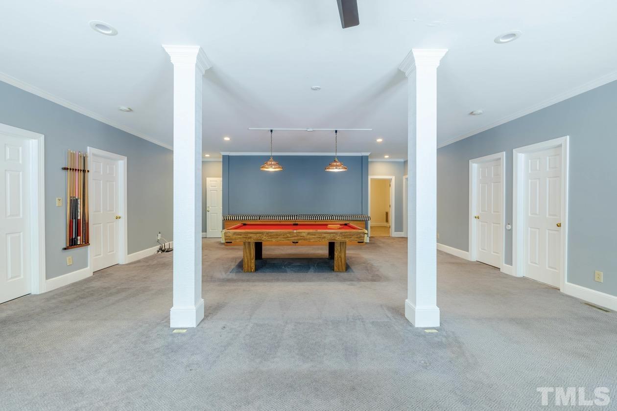 4205 Swarthmore Road Durham, NC 27707 - Photo 25 of 33 a back view of a room with a furniture and a ceiling fan