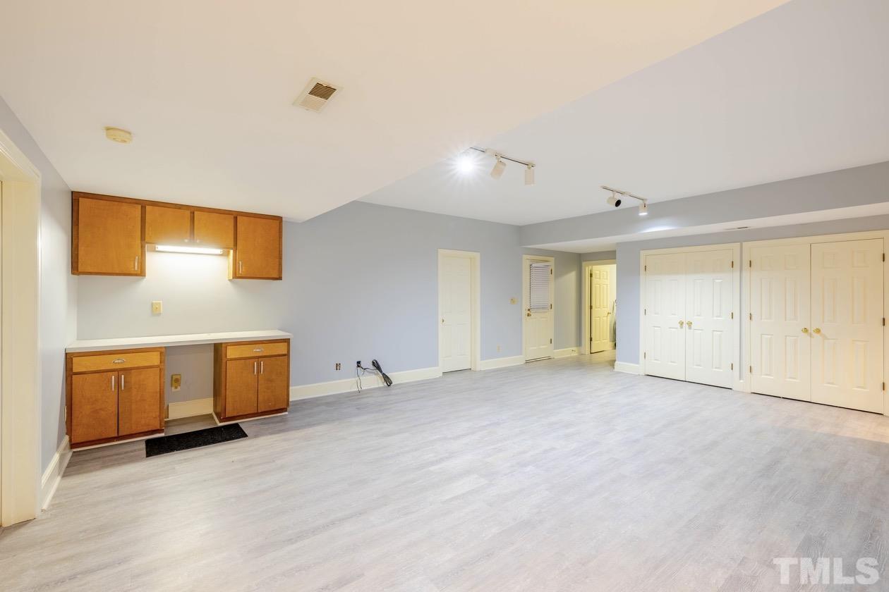 4205 Swarthmore Road Durham, NC 27707 - Photo 27 of 33 a view of an empty room with a window