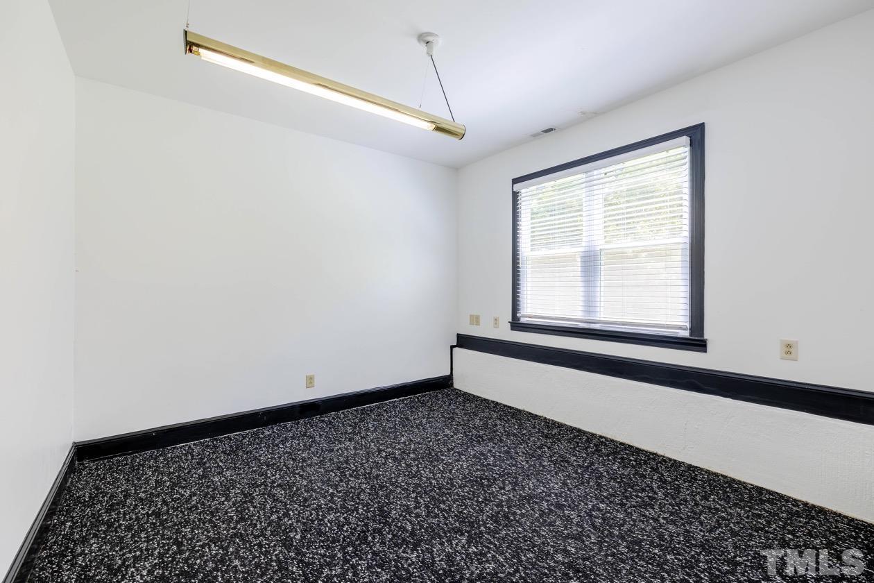 4205 Swarthmore Road Durham, NC 27707 - Photo 30 of 33 a big room with a window