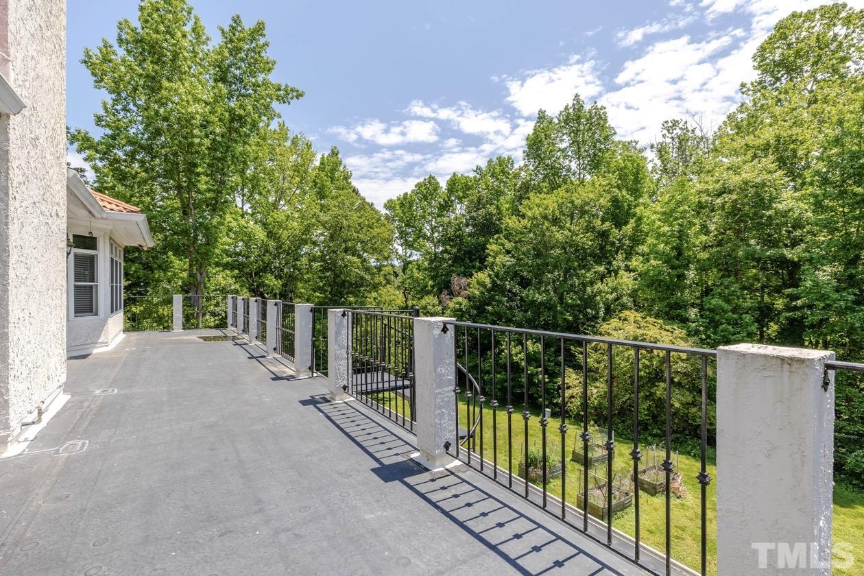 4205 Swarthmore Road Durham, NC 27707 - Photo 31 of 33 a view of balcony with deck and trees