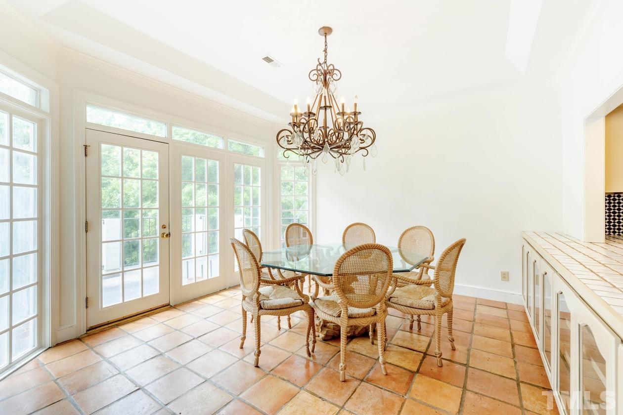 4205 Swarthmore Road Durham, NC 27707 - Photo 8 of 33 a view of a dining room with furniture and a chandelier