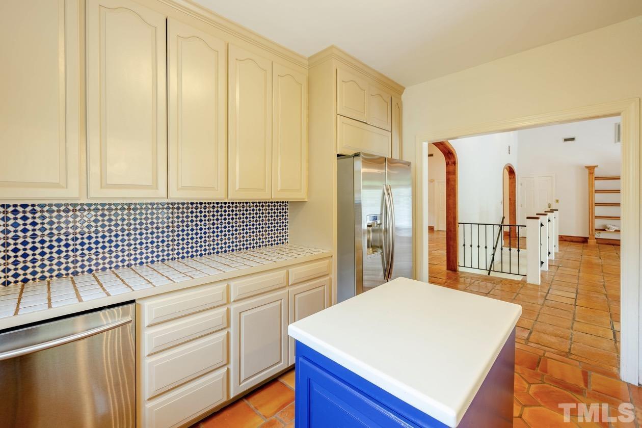4205 Swarthmore Road Durham, NC 27707 - Photo 9 of 33 a kitchen with a sink and cabinets