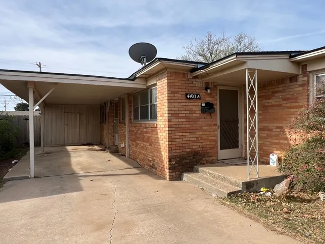 a front view of a house with garage