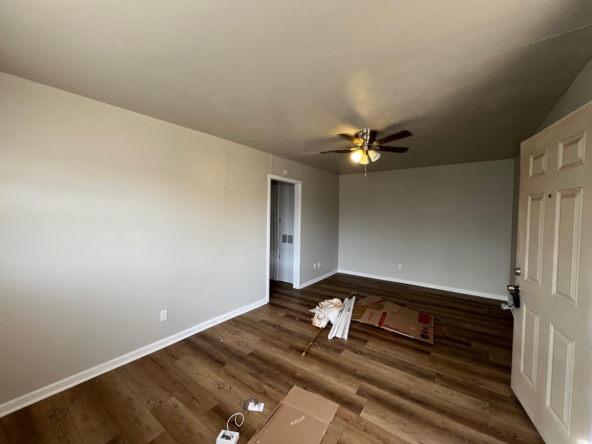 4403 31st Street, Unit A Lubbock, TX 79410 - Photo 3 of 11 a view of a livingroom with wooden floor