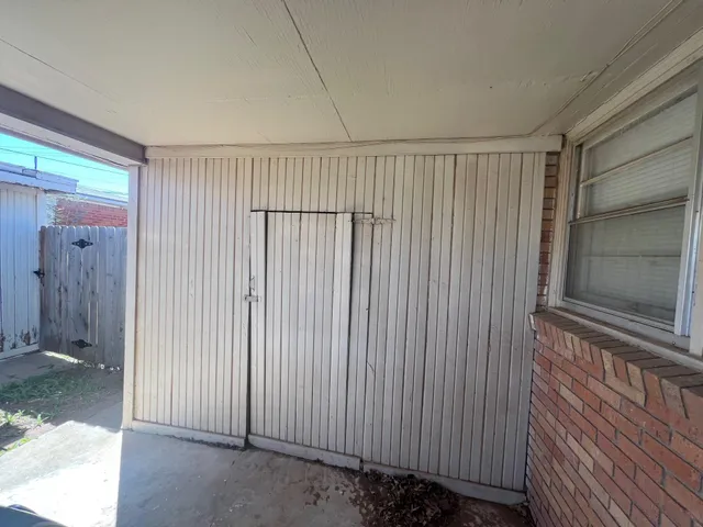a view of a livingroom with a brick wall