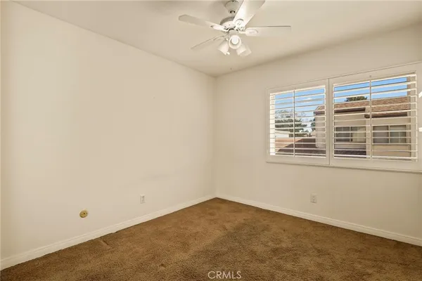 a bedroom with a large bed and a couch