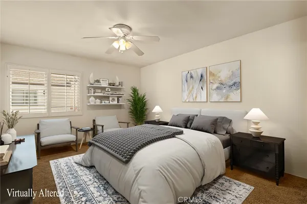 an empty room with a chandelier fan and windows