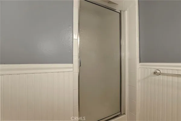 a bathroom with a sink toilet tub and shower