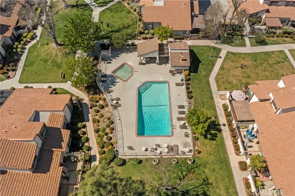 an aerial view of a house with a yard