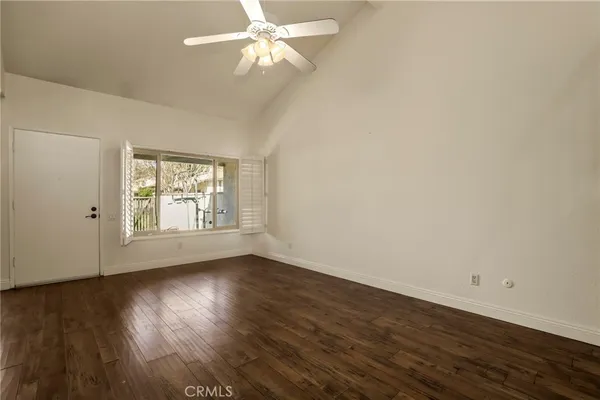 a kitchen with stainless steel appliances granite countertop a kitchen island a table and chairs in it
