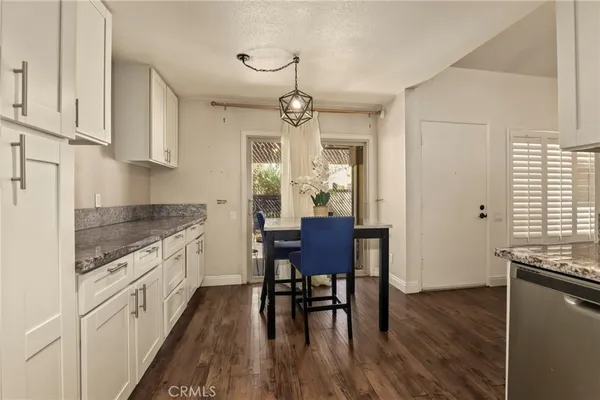 a kitchen with stainless steel appliances granite countertop a refrigerator stove microwave and sink