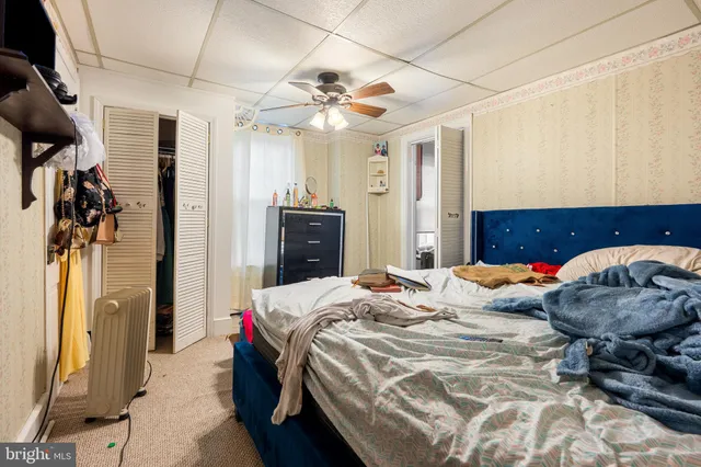 a view of a kitchen with sink and refrigerator