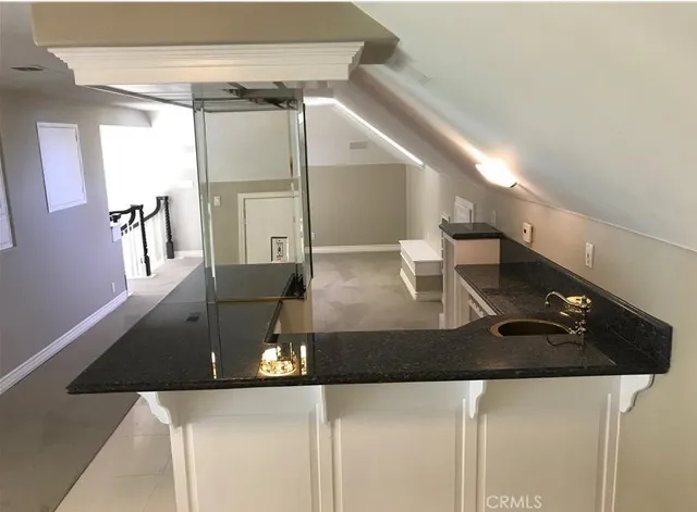 a living room with table and chairs