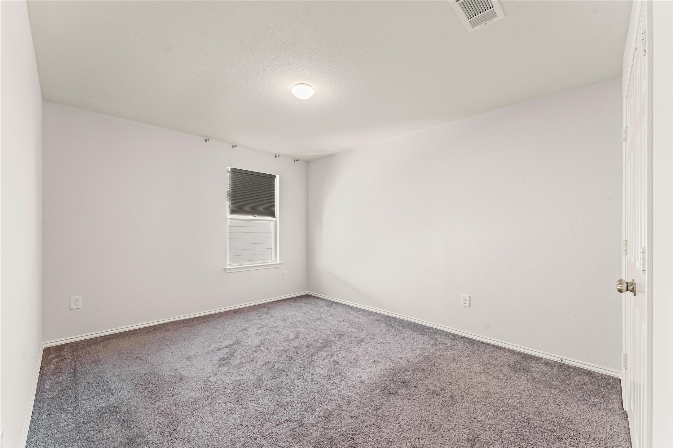 5826 Savanna Pasture Road Katy, TX 77493 - Photo 12 of 45 a view of an empty room with a window