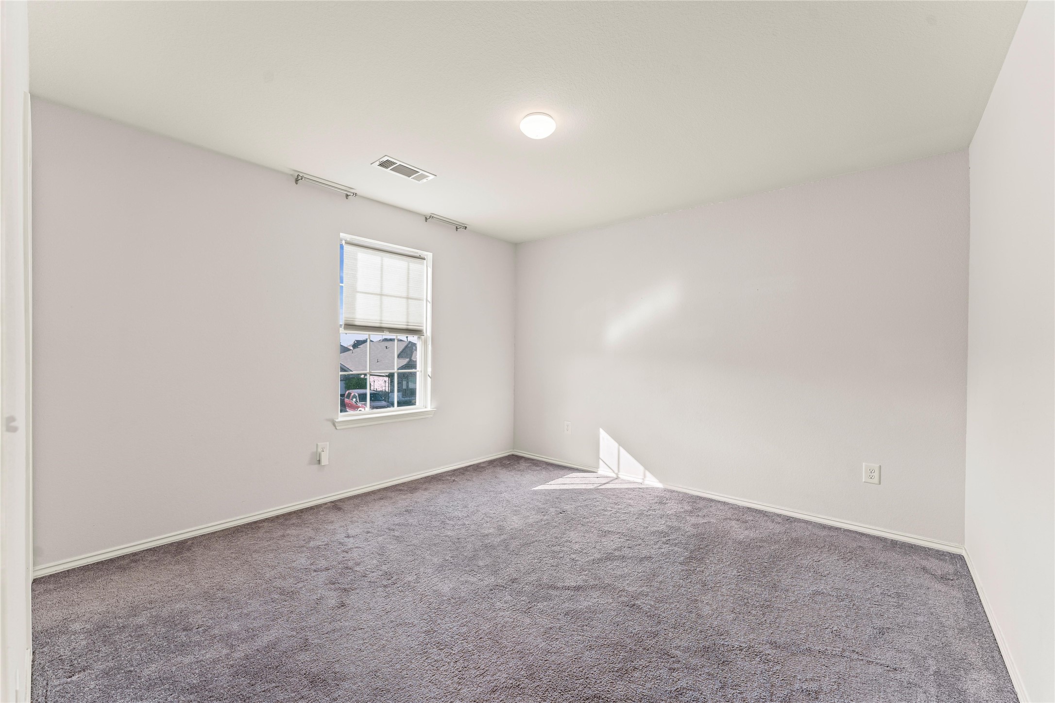 5826 Savanna Pasture Road Katy, TX 77493 - Photo 13 of 45 an empty room with windows