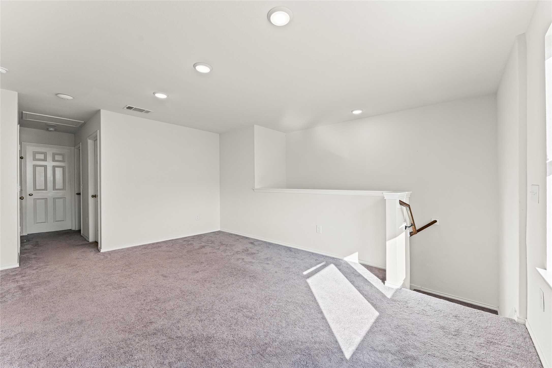 5826 Savanna Pasture Road Katy, TX 77493 - Photo 16 of 45 wooden floor in an empty room with a window