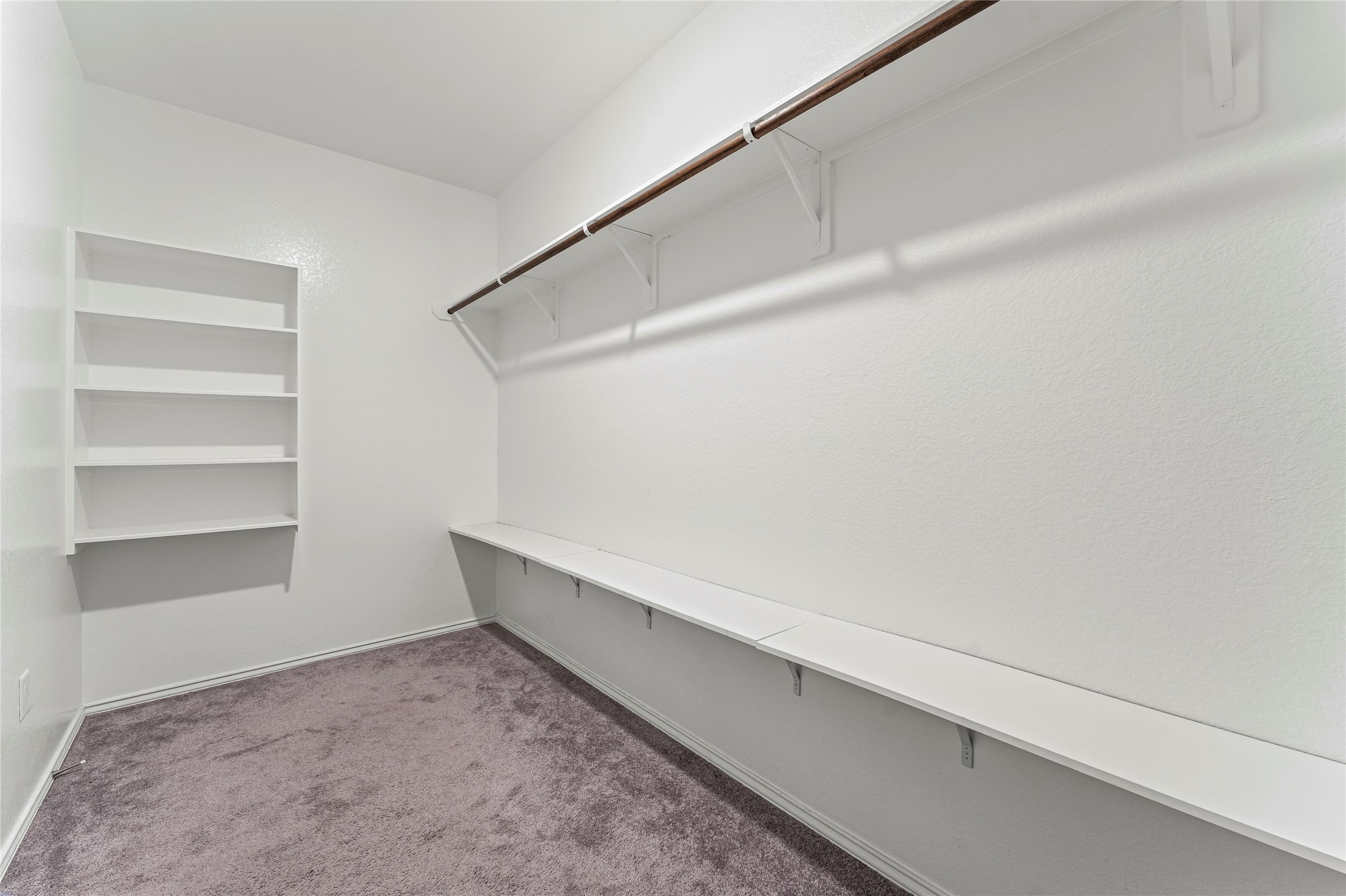 5826 Savanna Pasture Road Katy, TX 77493 - Photo 18 of 45 a view of an empty walk in closet