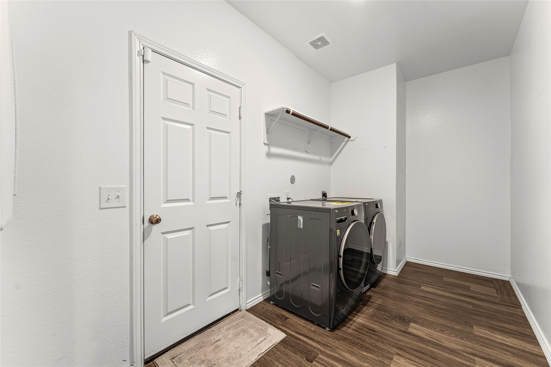 5826 Savanna Pasture Road Katy, TX 77493 - Photo 30 of 45 a view of a storage & utility room with wooden floor