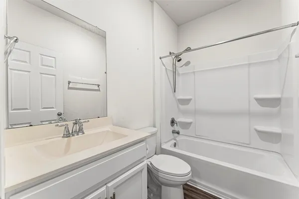 a bathroom with a sink a toilet and a bathtub