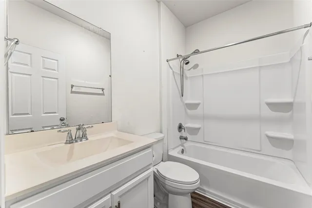 a bathroom with a sink a toilet and a bathtub