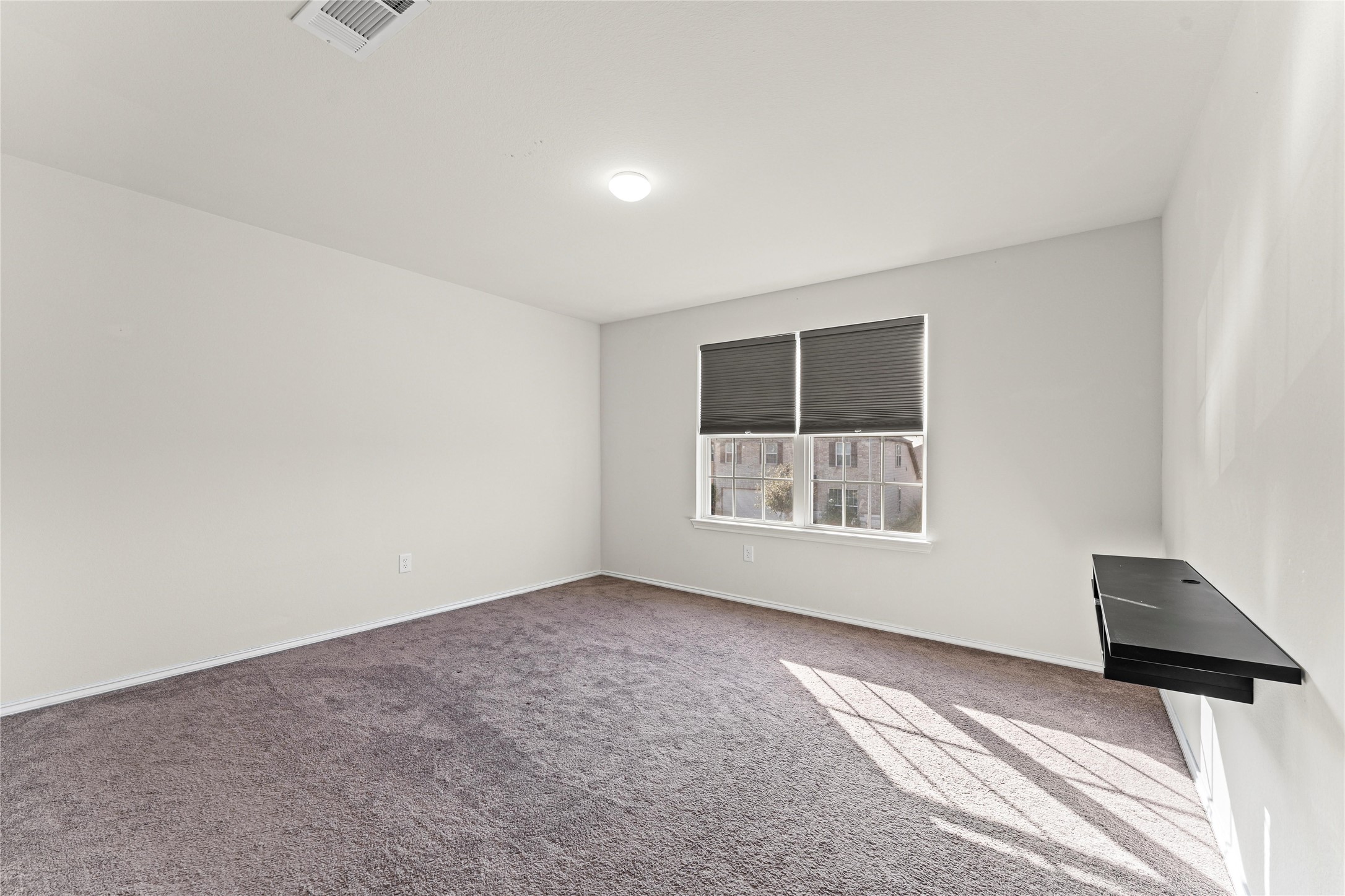 5826 Savanna Pasture Road Katy, TX 77493 - Photo 10 of 45 a view of an empty room with a window