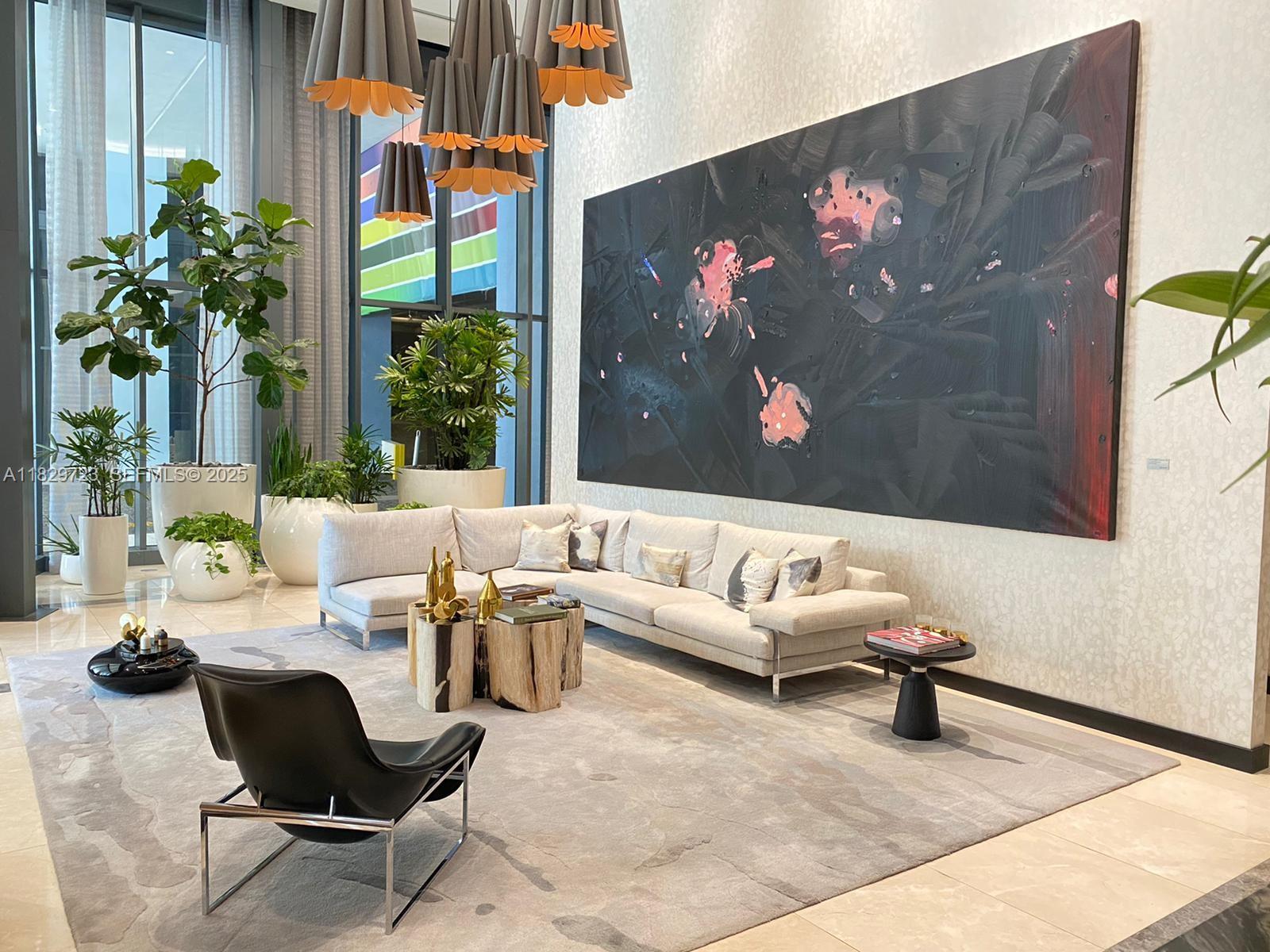 45 Southwest 9th Street, Unit 1706 Miami, FL 33130 - Photo 19 of 29 a living room with furniture and a painting on the wall