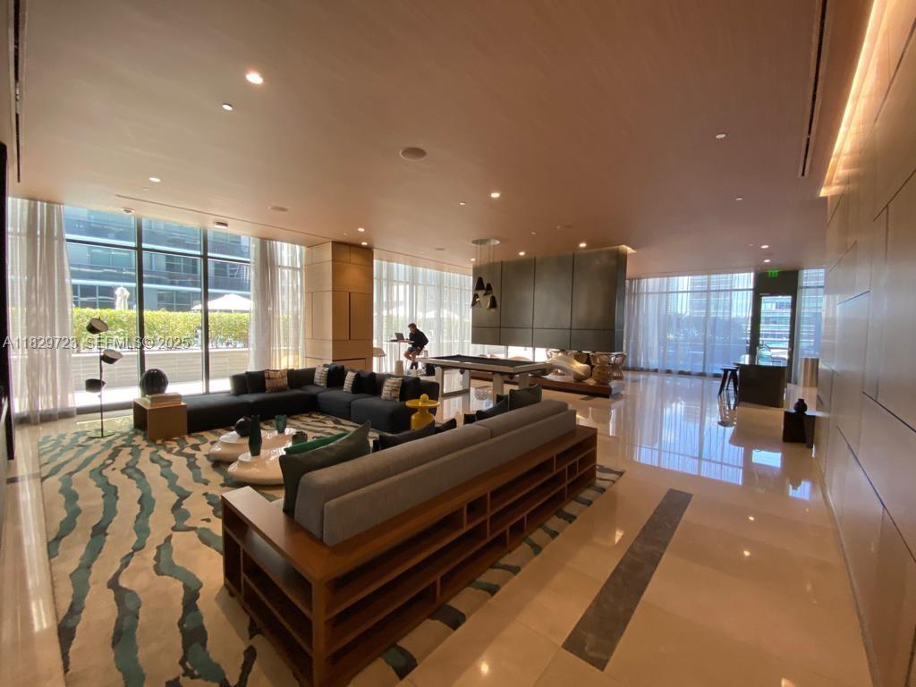 45 Southwest 9th Street, Unit 1706 Miami, FL 33130 - Photo 23 of 29 a large room with lots of chairs and a table