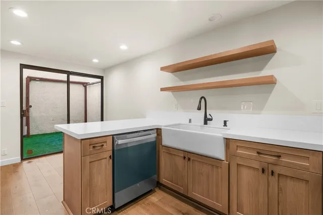 a kitchen with a sink and a stove