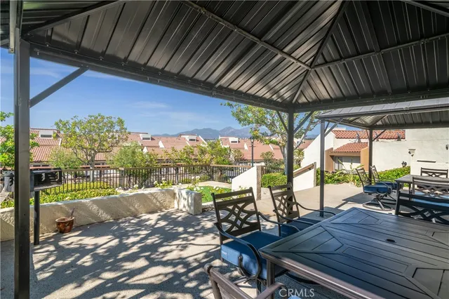 a view of a patio with wooden floor