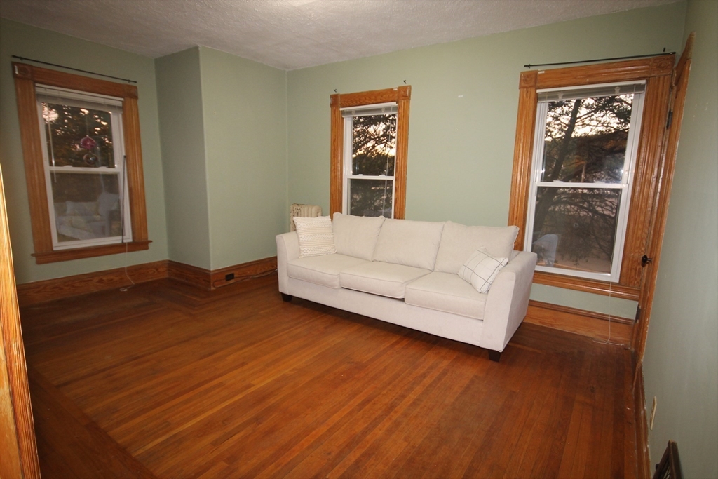 104 St James Avenue, Unit 2 Holyoke, MA 01040 - Photo 9 of 14 a living room with furniture and a window