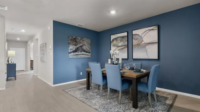 a view of a dining room with furniture