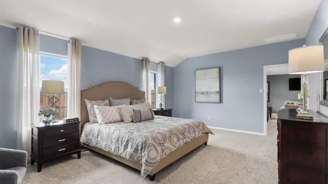 a bedroom with a bed and a dresser