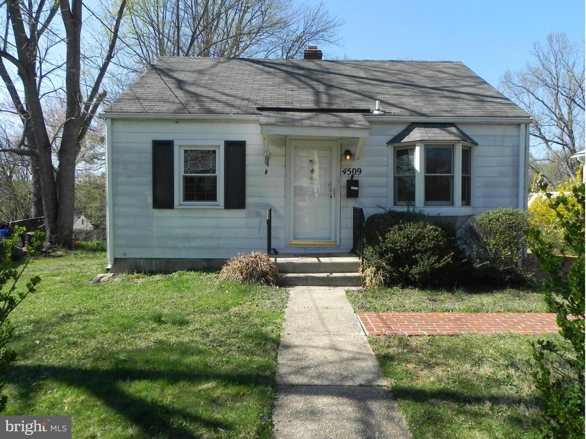 4509 Bennion Road Silver Spring, MD 20906 - Photo 1 of 18 a front view of a house with a yard