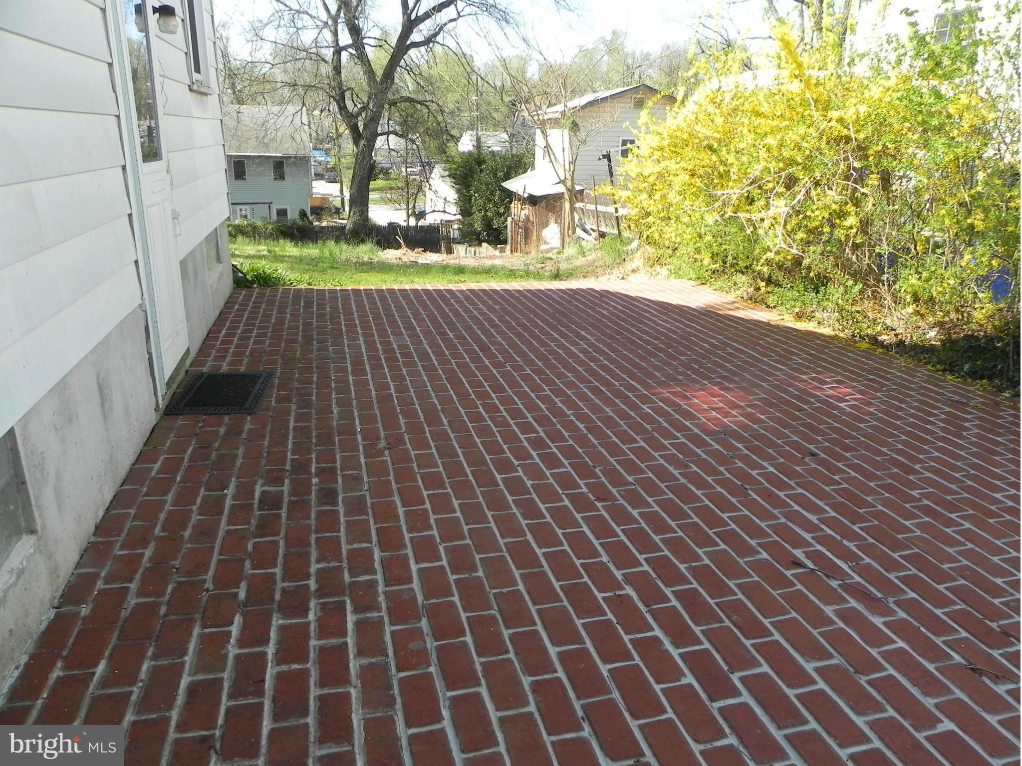 4509 Bennion Road Silver Spring, MD 20906 - Photo 17 of 18 a view of a pathway both side of building