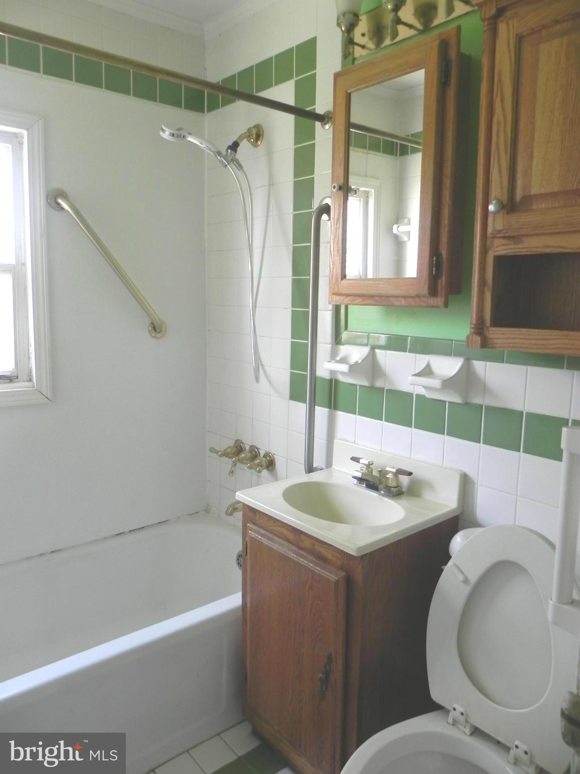 4509 Bennion Road Silver Spring, MD 20906 - Photo 6 of 18 a bathroom with a sink toilet and shower