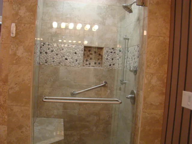 a bathroom with a glass shower door