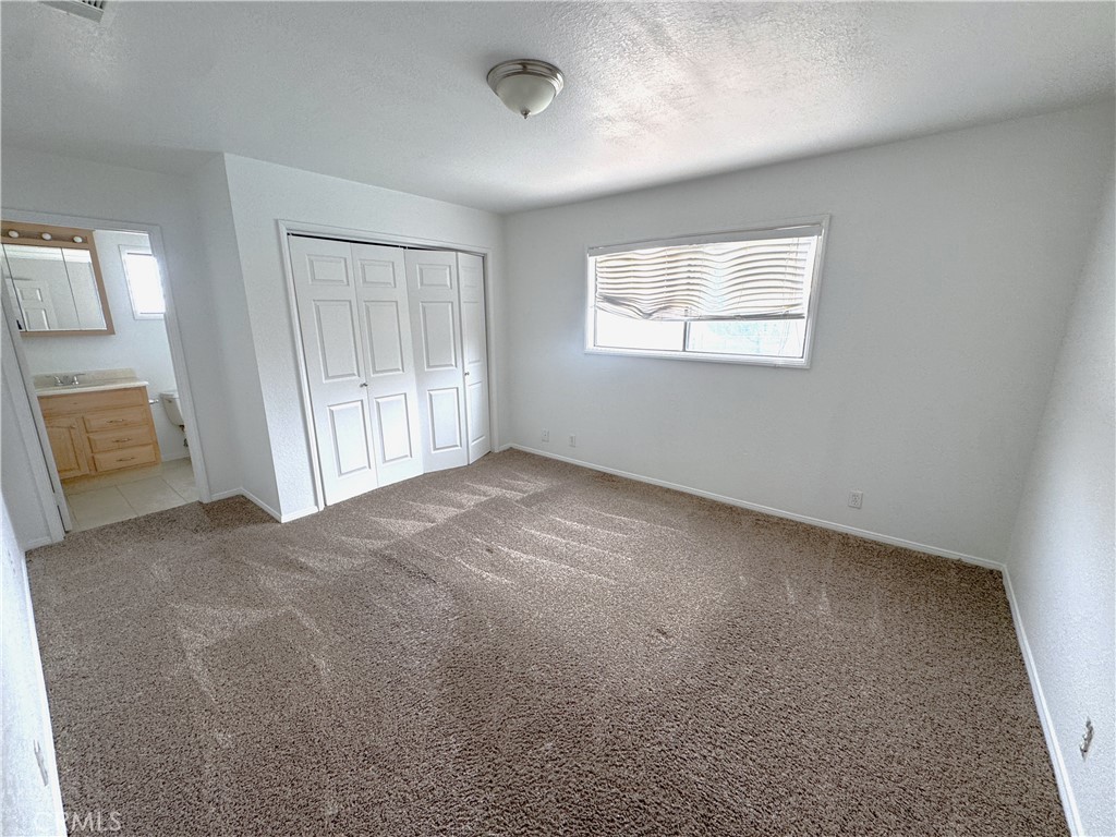 44450 Lowtree Avenue Lancaster, CA 93534 - Photo 16 of 24 a view of an empty room with a window