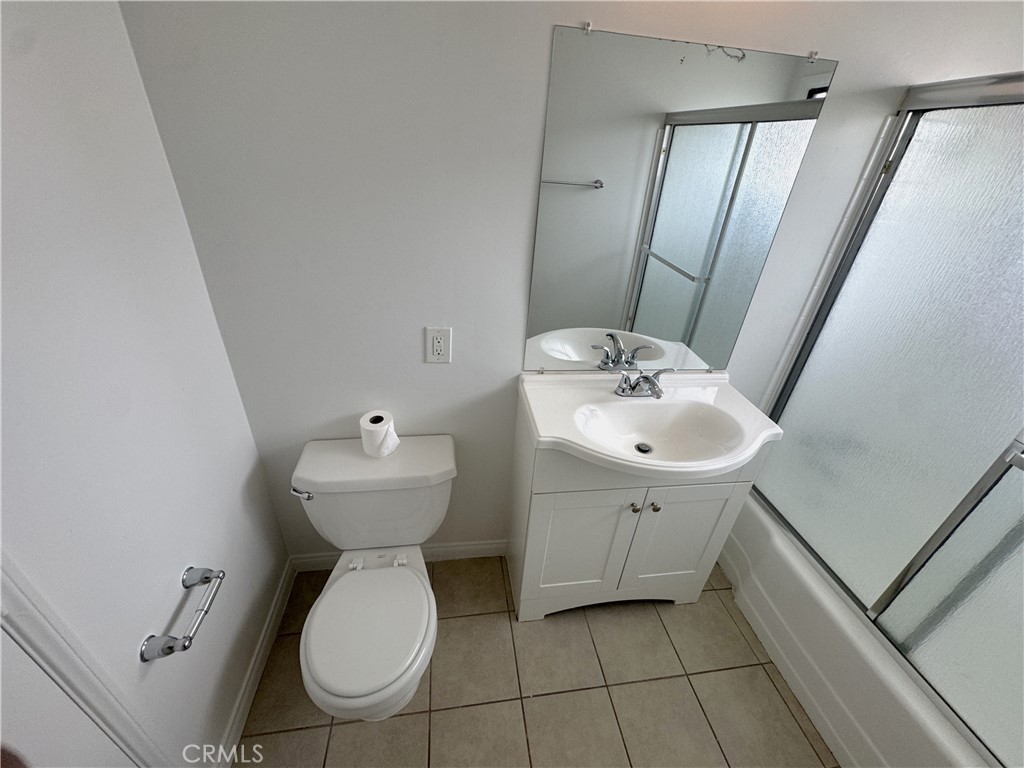 44450 Lowtree Avenue Lancaster, CA 93534 - Photo 21 of 24 a bathroom with a sink mirror and toilet